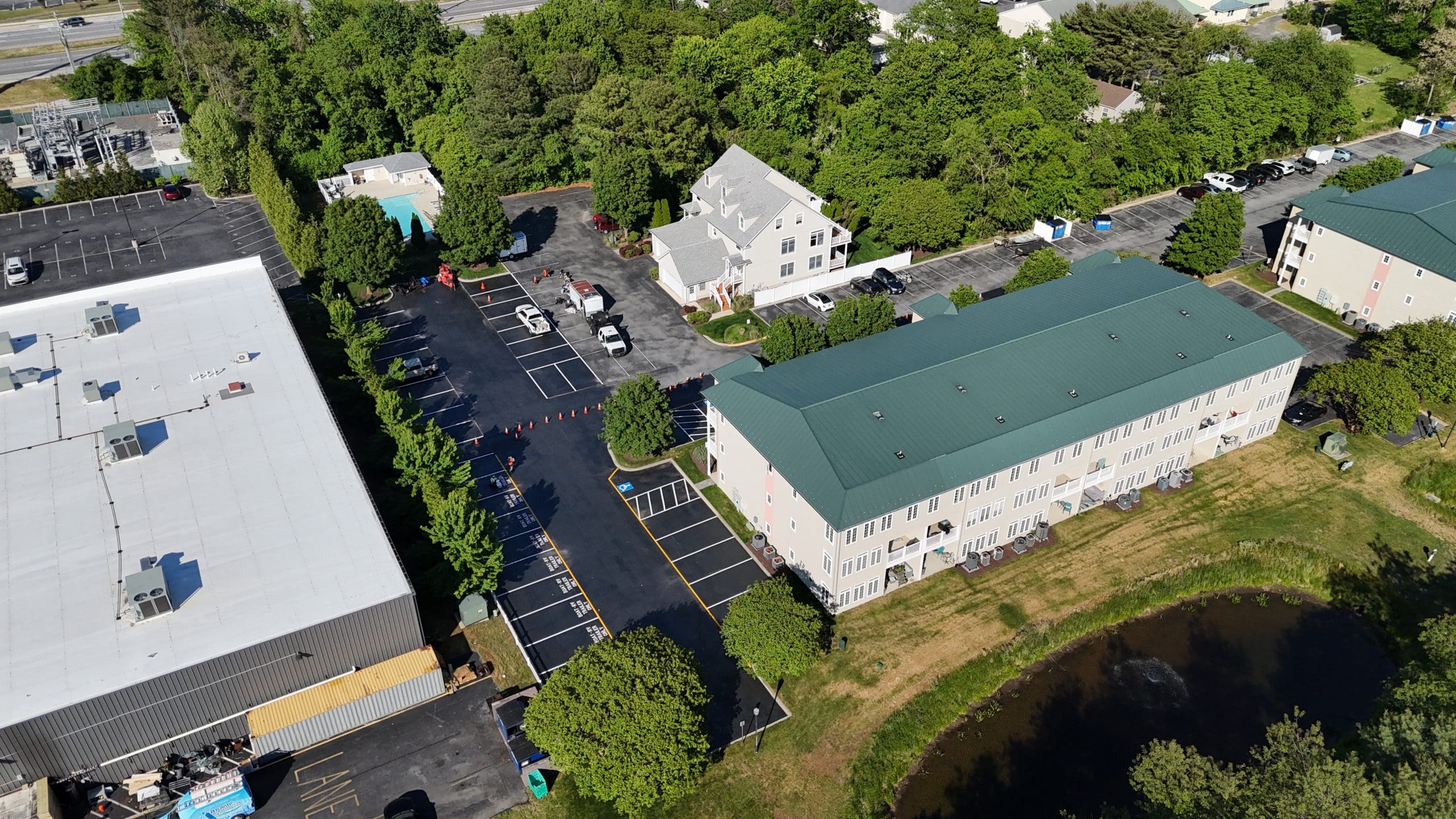 Why Asphalt Rejuvenation is Replacing Traditional Sealcoating for HOAs and Municipalities in Delaware